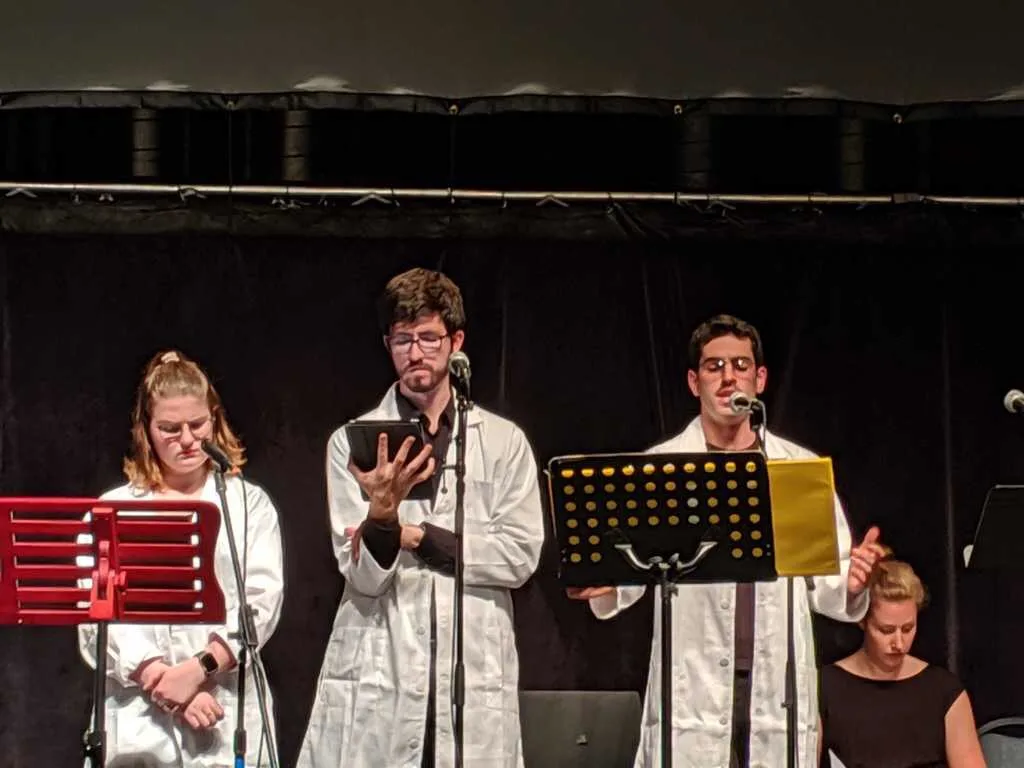 Close-up of performers at the Haber staged reading